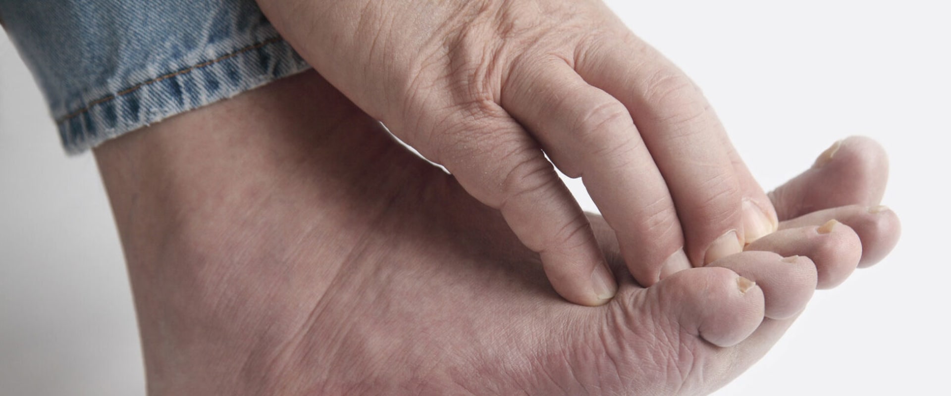 What causes neuropathy in the feet to be exacerbated?